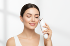 Woman using Veluné Aura Pore Clean Vacuum on her nose