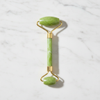 Veluné Aura Sculpting Gua Sha Stone on white marble