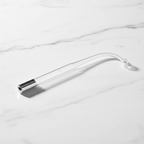 Veluné Aura GlowPulse 5-in-1 Skin Renewal System on white marble surface