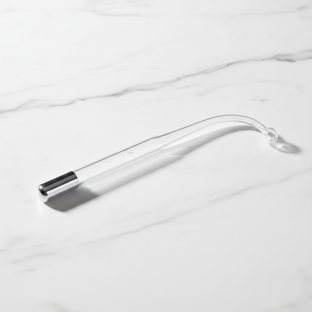 Veluné Aura GlowPulse 5-in-1 Skin Renewal System on white marble surface