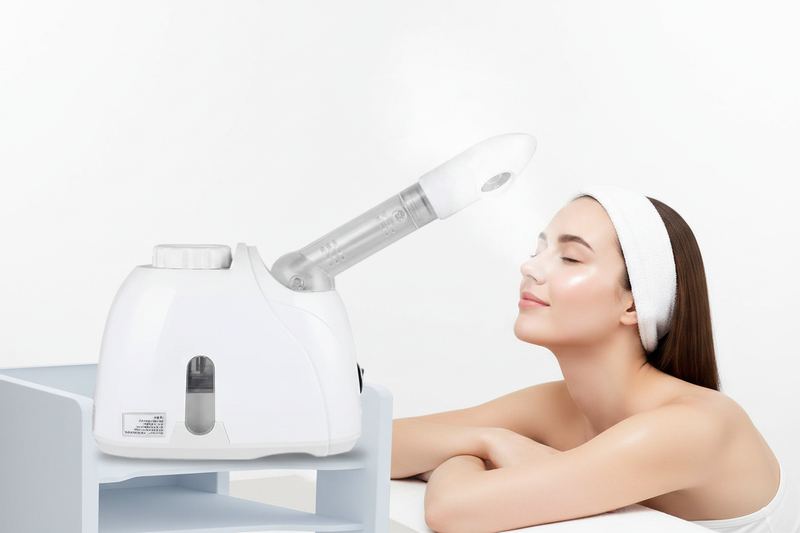 Woman enjoying steam from Veluné Aura Deep Clean Facial Steamer