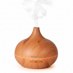 Close-up of Veluné Aura Calm Mist Diffuser glowing with gentle mist