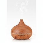 Veluné Aura Calm Mist Diffuser on white background with soft mist