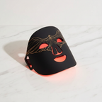 Veluné Aura LED Skin Renewal Mask on white marble